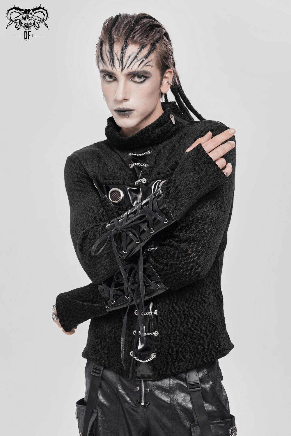 Bold Knit Turtleneck with Faux Leather Straps and Chains worn by a model showcasing gothic fashion.