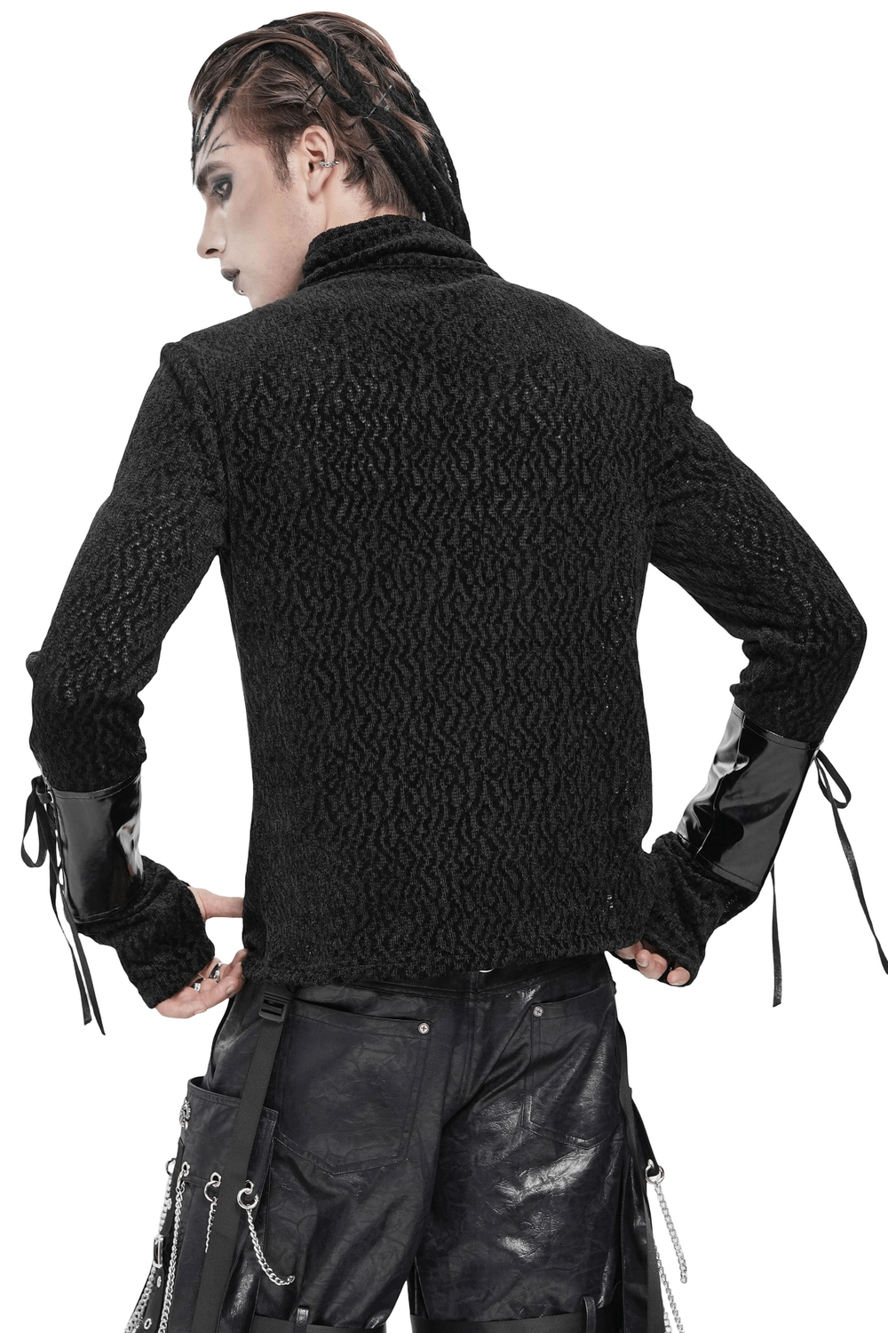 Bold Knit Turtleneck with Faux Leather Straps and Chains worn from the back, showcasing its edgy design and lace-up cuffs.