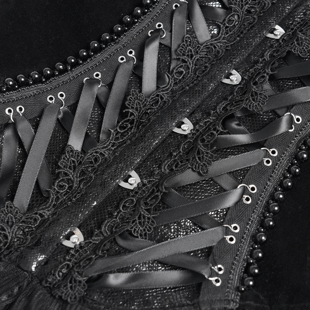 Close-up of goth lace-up corset showcasing satin ribbons, intricate lace detailing, and ruffled trim.