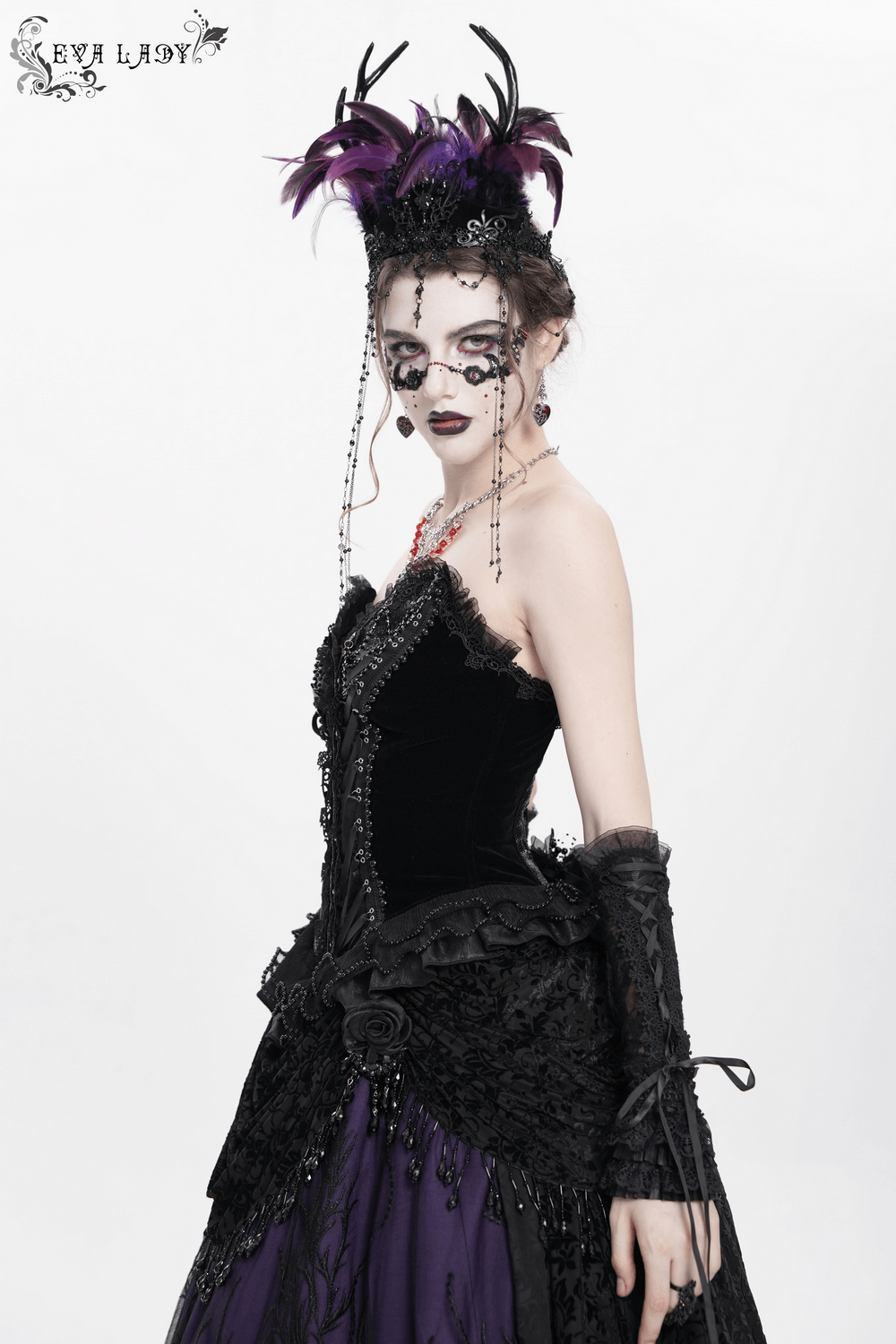 Elegant model in gothic lace-up corset with ruffle trim and dramatic makeup, showcasing a bold vintage style.