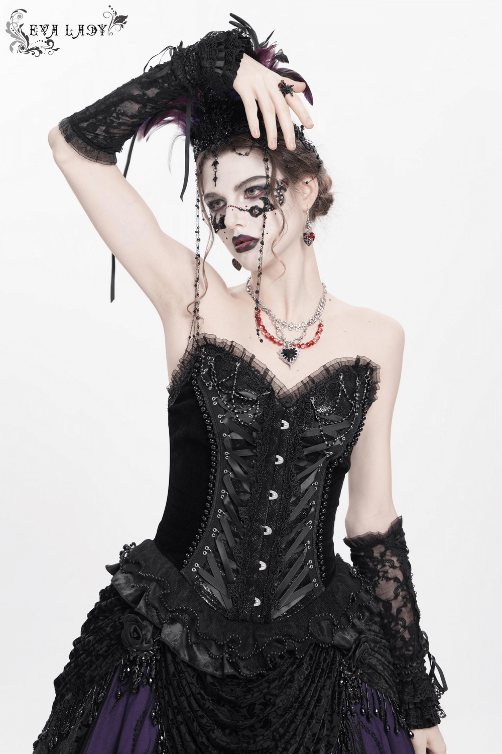 Gothic lace-up corset with ruffled trim and satin straps, creating a dramatic vintage look.