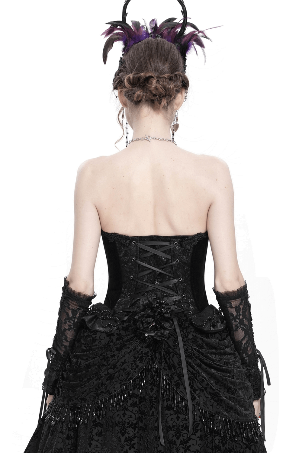 Back view of a gothic lace-up corset with ruffle trim and satin straps, showcasing intricate lace and a fitted silhouette.