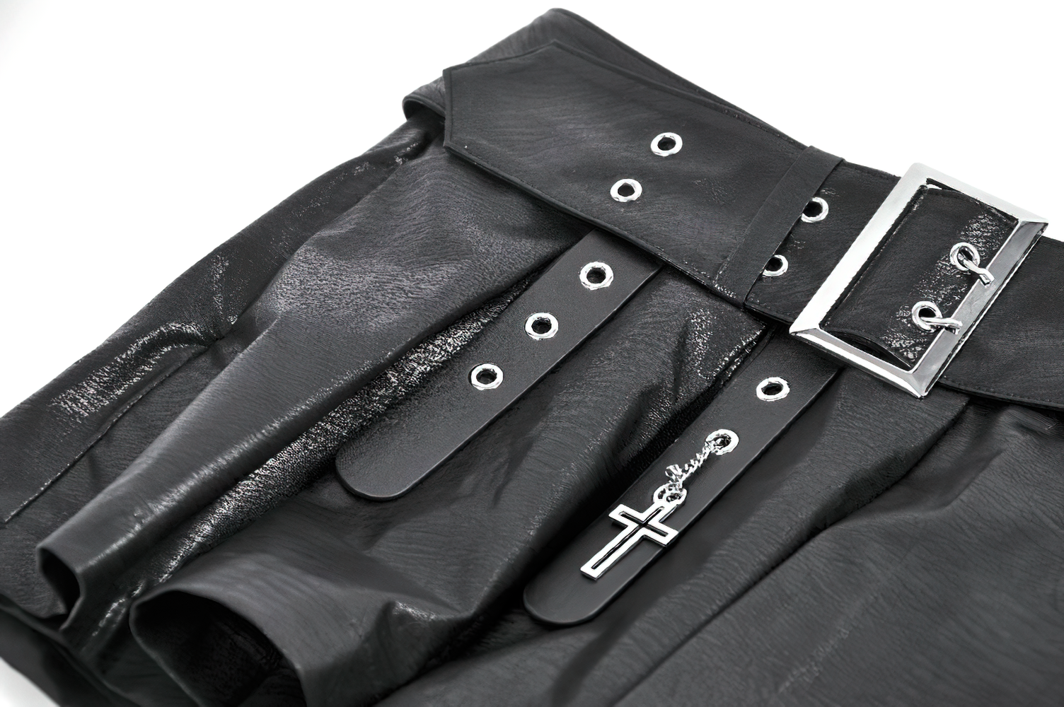 Bold Pleated Skirt Shorts with Belt and Cross Charm close-up showing leather texture and buckle details.