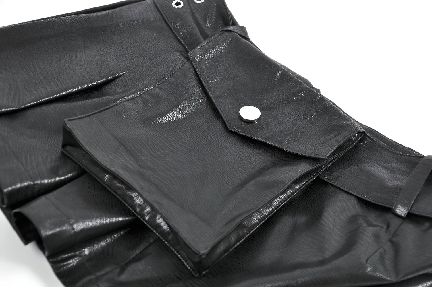 Bold Pleated Skirt Shorts with Belt and Cross Charm details featuring faux leather and a utility pocket.