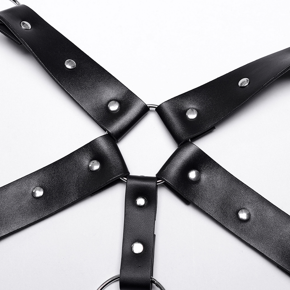 Close-up of a bold PU leather body harness featuring intricate metal accents and adjustable straps.