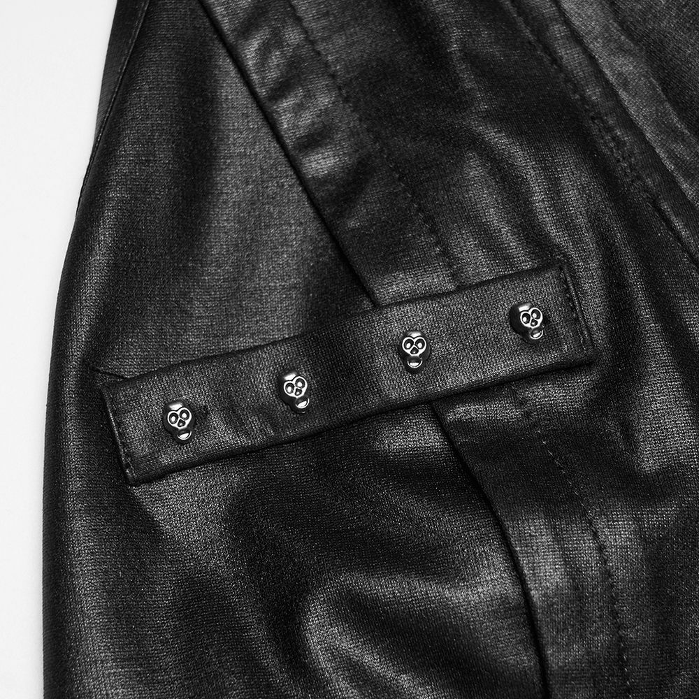Close-up of Bold Punk Vest with Cross Pendant and Adjustable Drawstrings showcasing skull rivets on the black fabric.