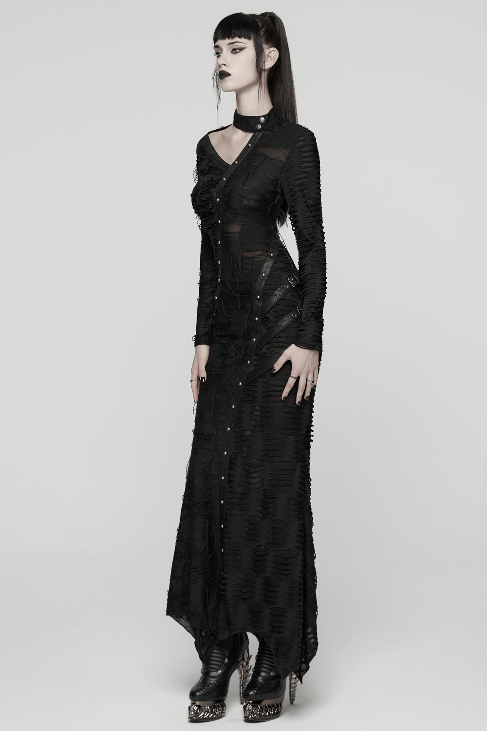 Bold Ragged Knit and Leather Long Asymmetric Dress modeled in a punk aesthetic with rivet details.