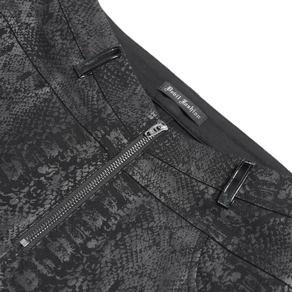 Close-up of bold skinny pants featuring snakeskin pattern, zippers, and PU leather accents for edgy streetwear style.