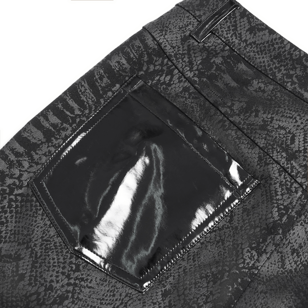 Close-up of gothic skinny pants showcasing a snakeskin pattern and glossy PU leather side pocket detail.