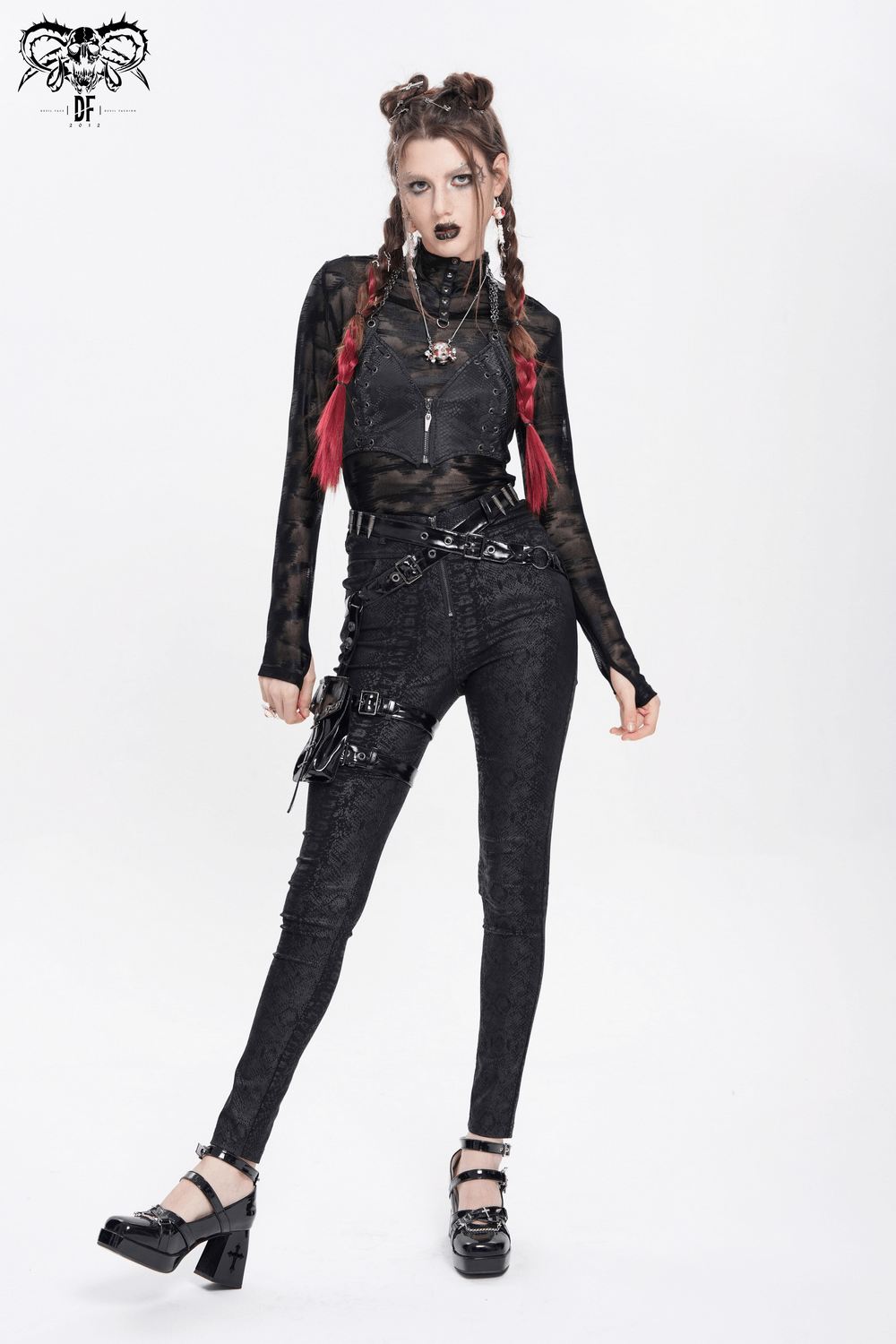 Gothic punk model in bold skinny pants with straps and side pouch, showcasing edgy streetwear fashion.