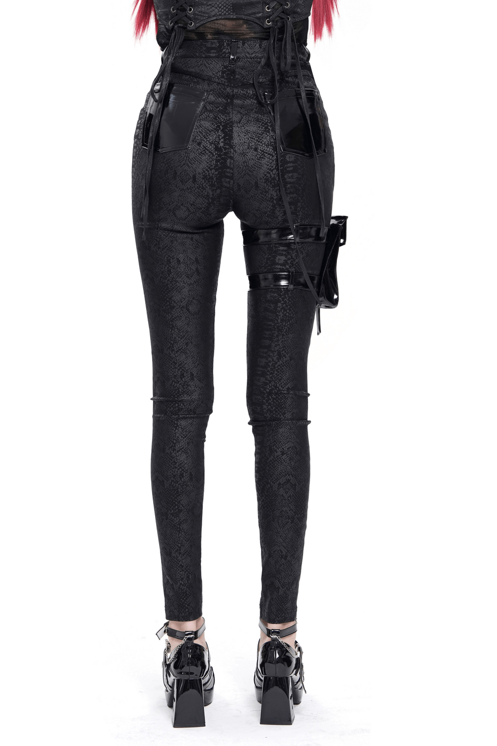Black skinny pants with straps, faux leather pockets, and a detachable side pouch, showcasing a punk style.