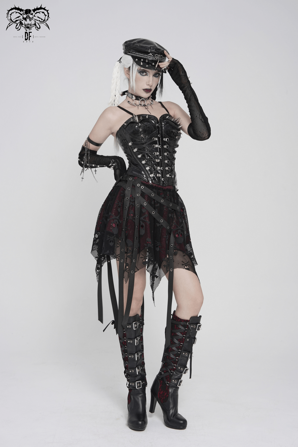 Bold Spike Corset Top with Lace Up Punk Hardware worn with a gothic skirt and high-heeled boots.