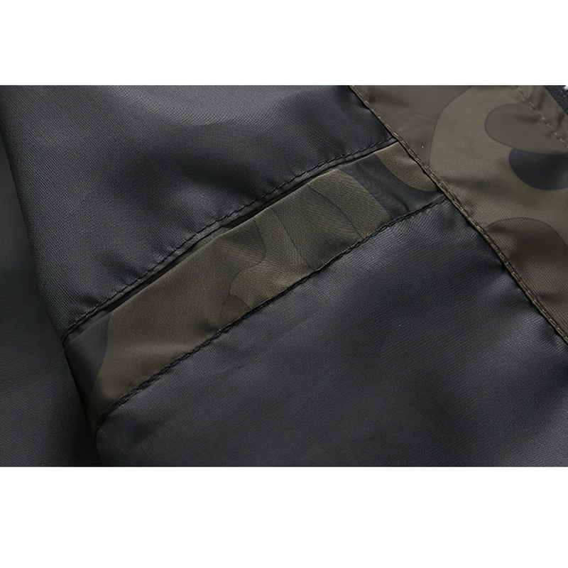 Close-up of camouflage fabric on bomber men's jacket, showcasing trendy style and quality stitching.