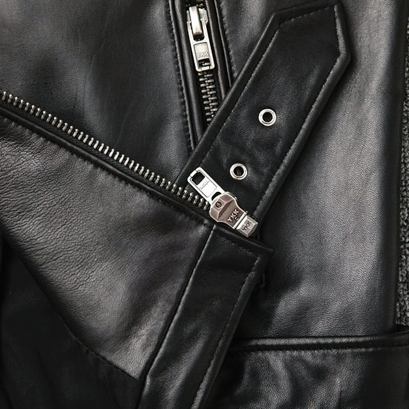 Close-up of zipper detail on a men's genuine leather biker jacket showcasing sleek black leather and metal accents.