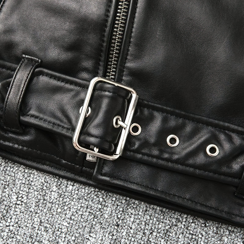 Close-up of the adjustable belt buckle on a men's genuine leather biker jacket, highlighting its classic style.
