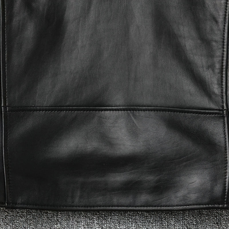 Genuine leather biker jacket bottom view showcasing sleek black texture and minimalist design, perfect for a classic slim fit.