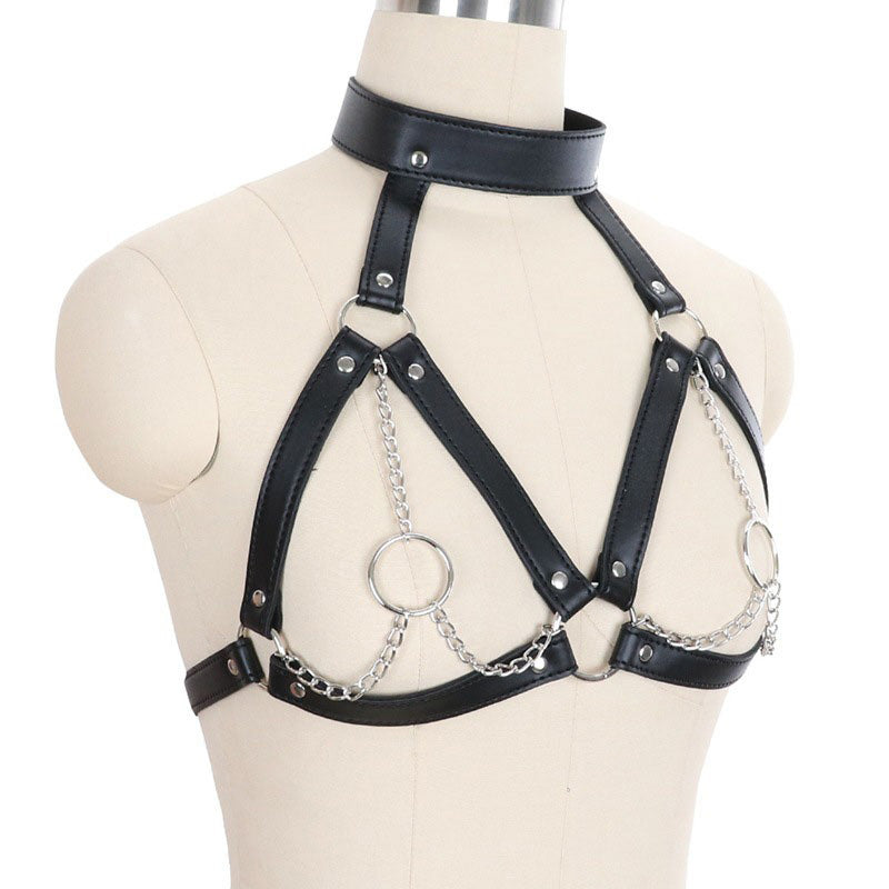 Faux leather breast bondage harness belt with iron chains, gothic style, displayed on a mannequin.