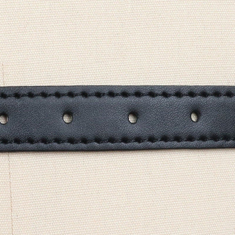 Close-up of a black faux leather strap with stitching and holes, ideal for a breast bondage harness accessory.