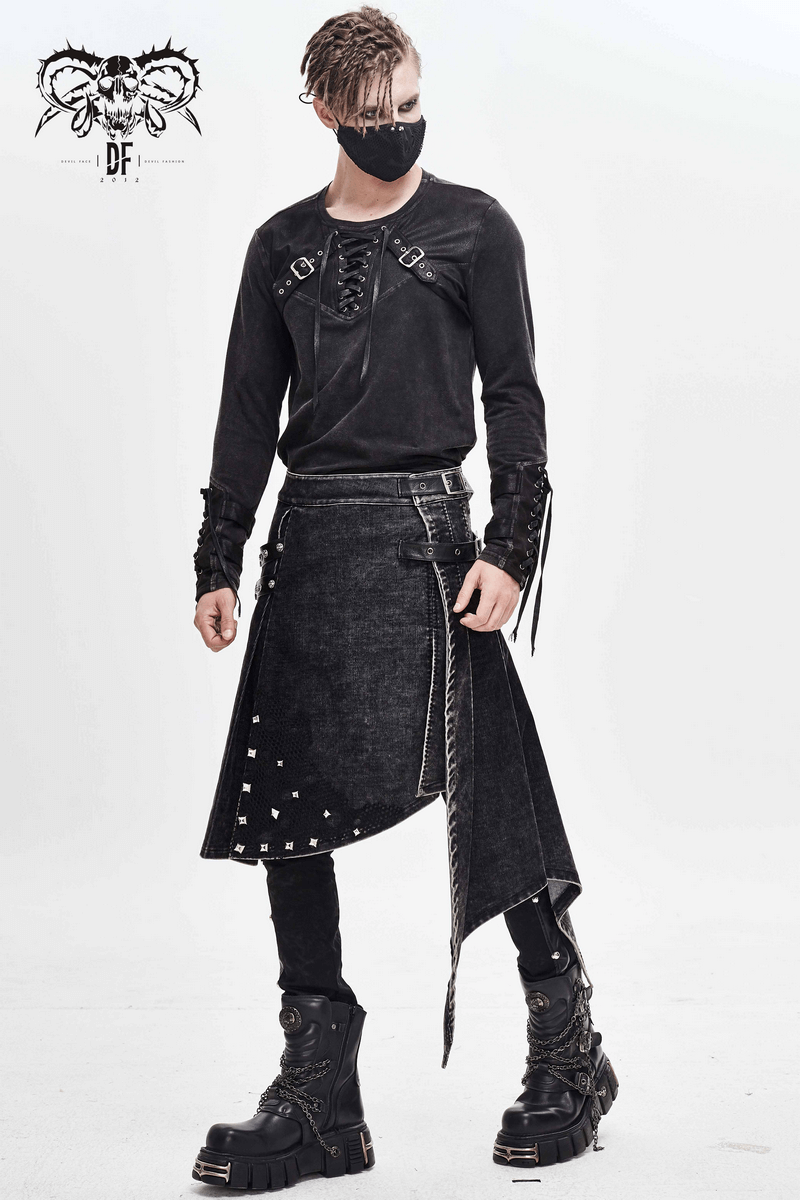Stylish man in gothic outfit with skull mask, black long-sleeve shirt, and unique asymmetrical skirt.