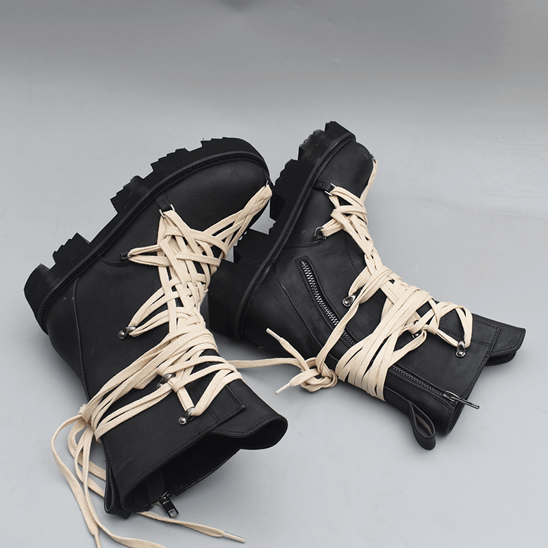 Black British style high-top ankle boots with white laces and side zipper, perfect for trendy men and women.