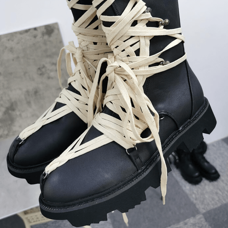 British style high-top ankle boots for men and women with unique beige laces and thick soles.