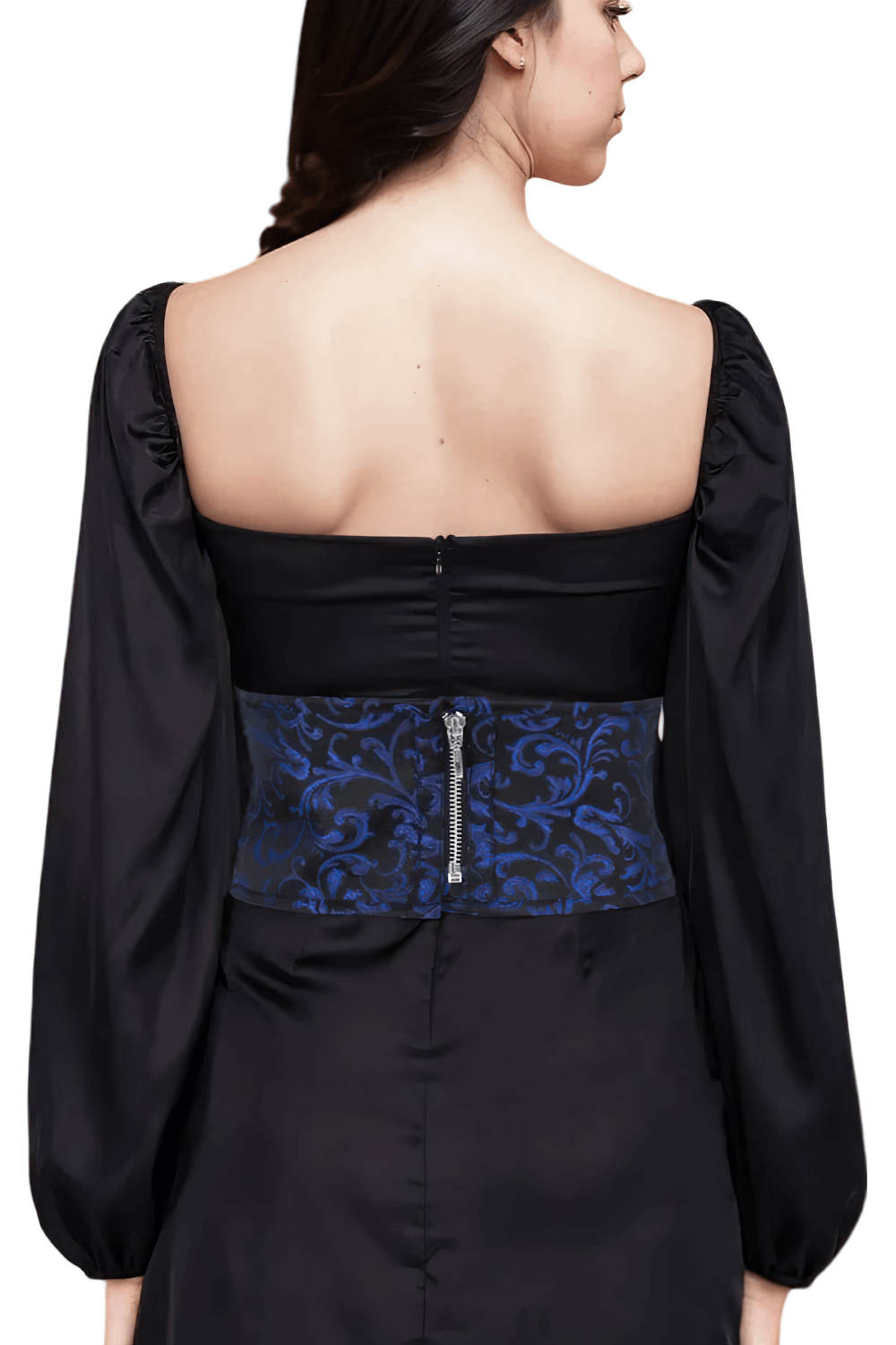 Back view of a model wearing a brocade corset-inspired belt with zip closure and lace detailing.