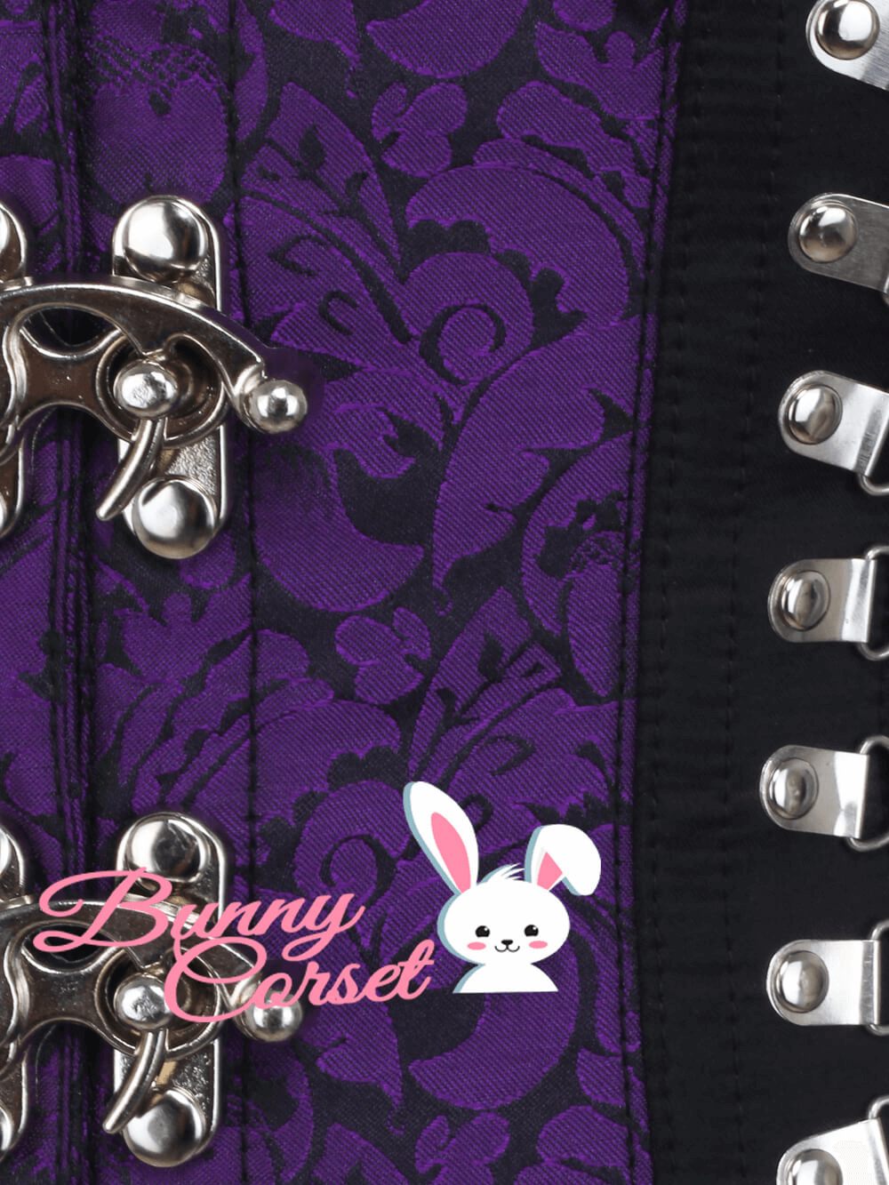 Close-up of a purple brocade underbust corset with satin accents and metal clasps for an elegant look.