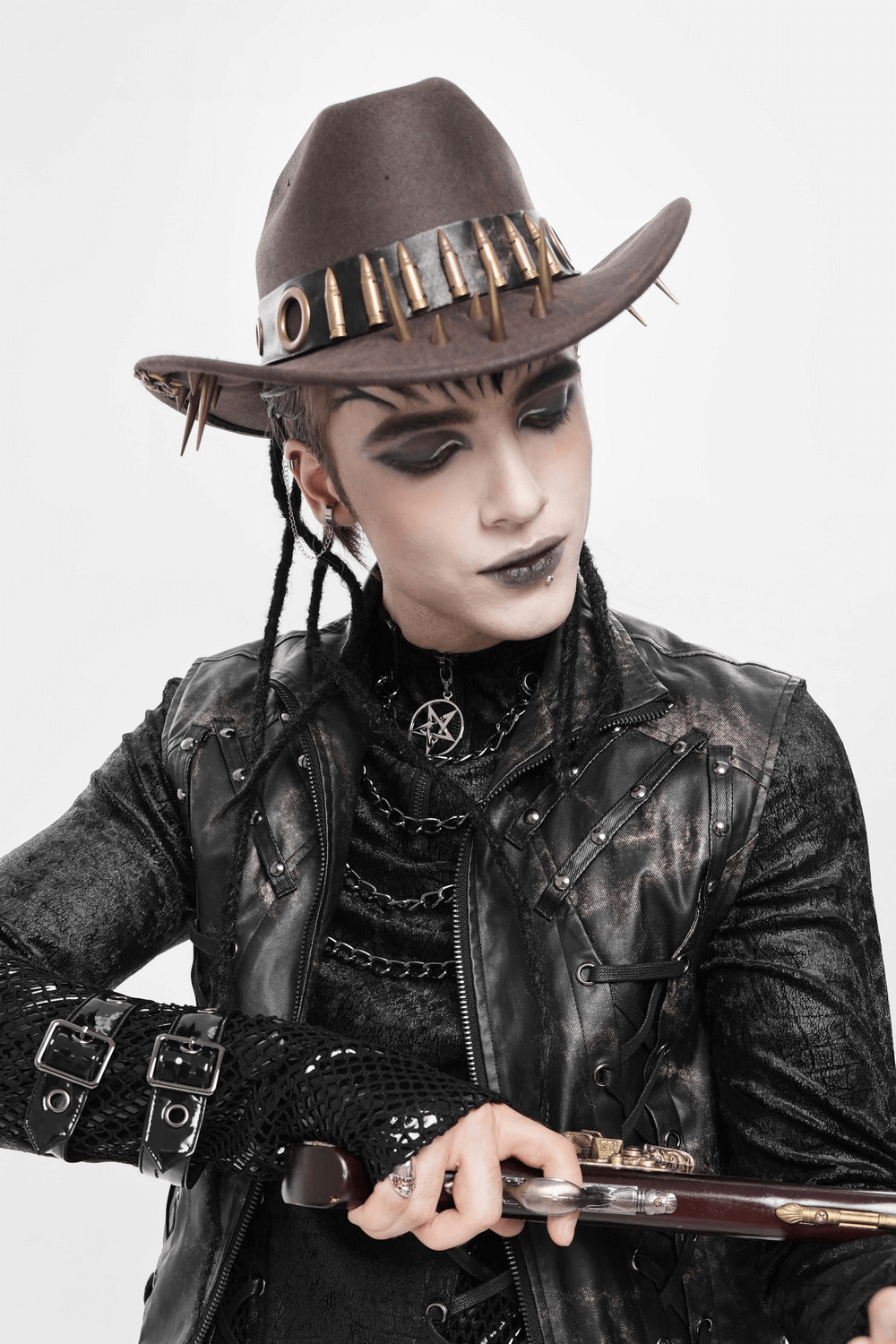 Brown Gothic Cowboy Hat with Metal Bullets and Spikes worn by a model in a dark steampunk outfit.