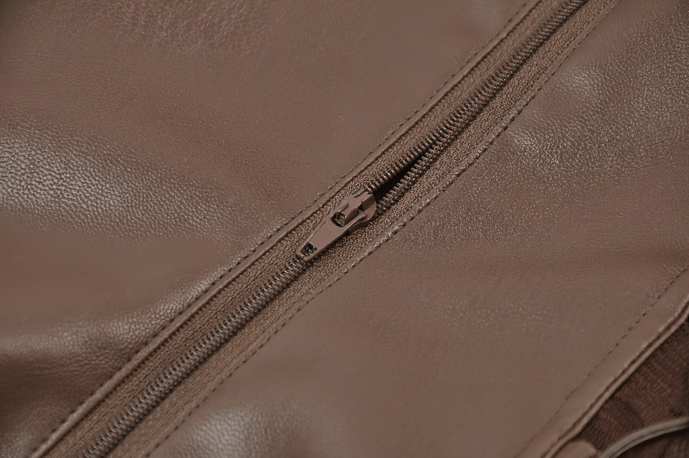 Close-up of the zipper on a Brown Steampunk Buckle Lace Up Corset Top for Women, showcasing faux leather texture.