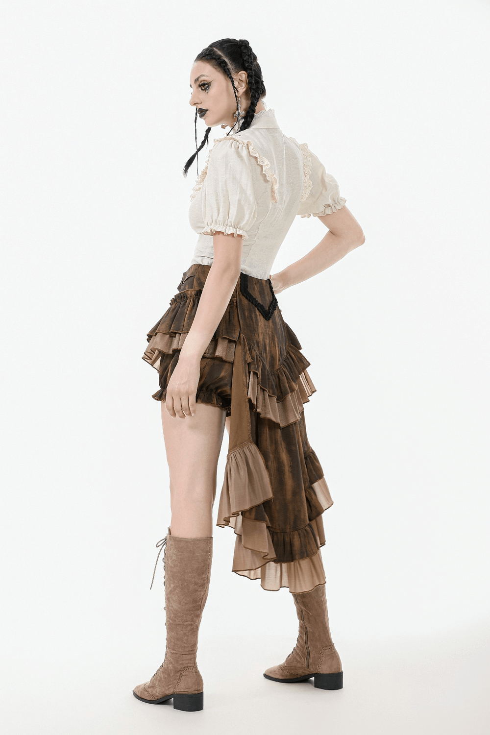 Model showcasing a brown steampunk ruffled skirt shorts with cascading train and vintage-inspired design.