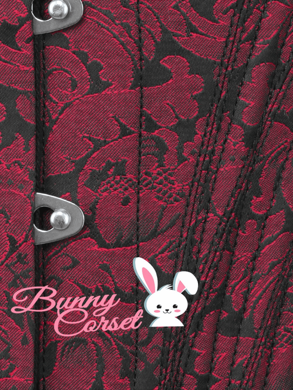 Close-up of burgundy brocade waist training corset showcasing intricate pattern and front metal busk closure.