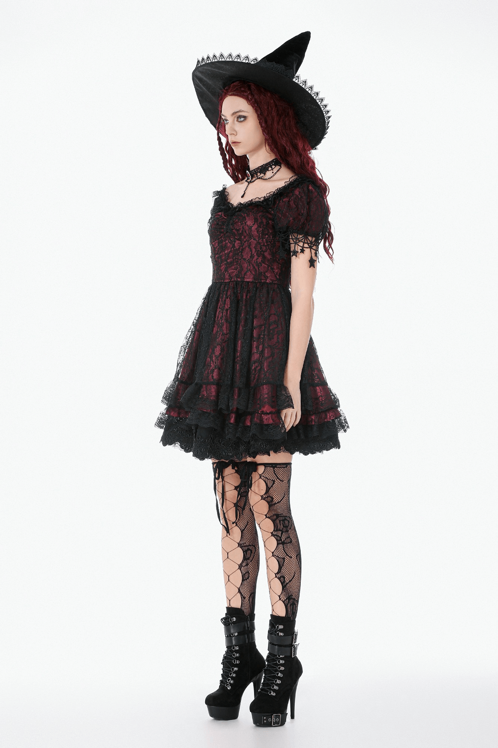 Burgundy Gothic Lace Corset Dress with Star Charm Sleeves worn with a witch hat and lace stockings, showcasing dark romance.