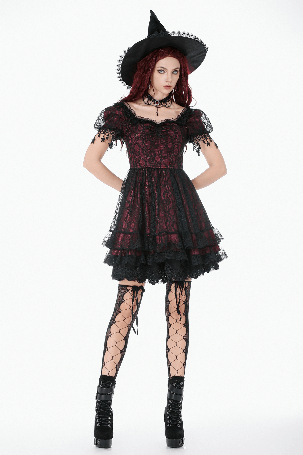 Burgundy Gothic Lace Corset Dress with Star Charm Sleeves worn with a witch hat and lace-up fishnet stockings.