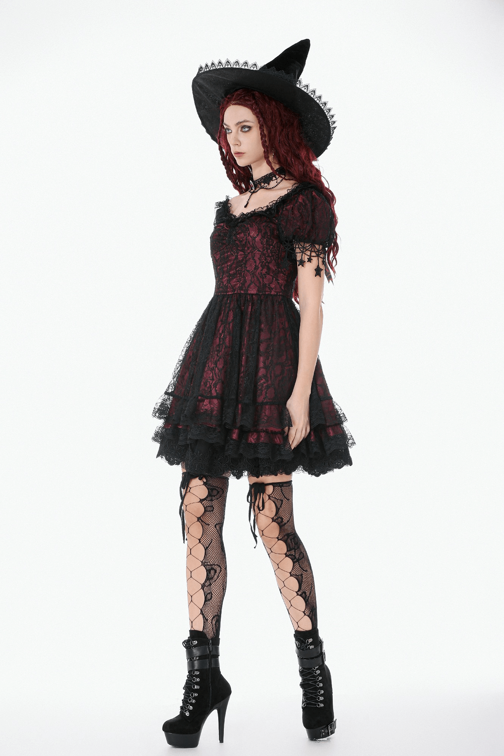 Burgundy Gothic Lace Corset Dress with Star Charm Sleeves worn by model with witch hat and fishnet stockings.