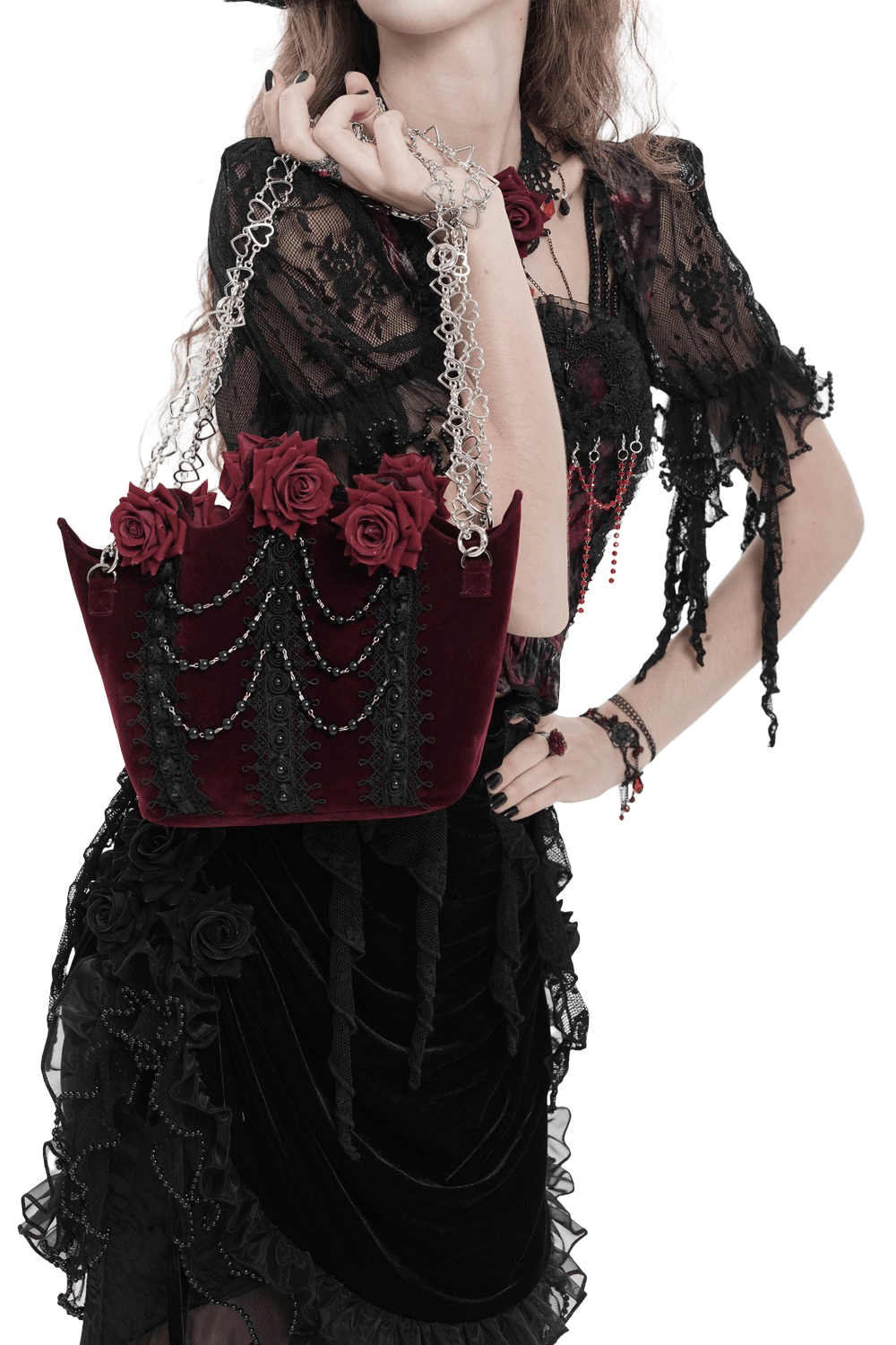 Alt Tag: Burgundy Gothic Rose Handbag with Lace and Chains on model, burgundy velvet roses, black lace panels, draped beads, silver heart chains