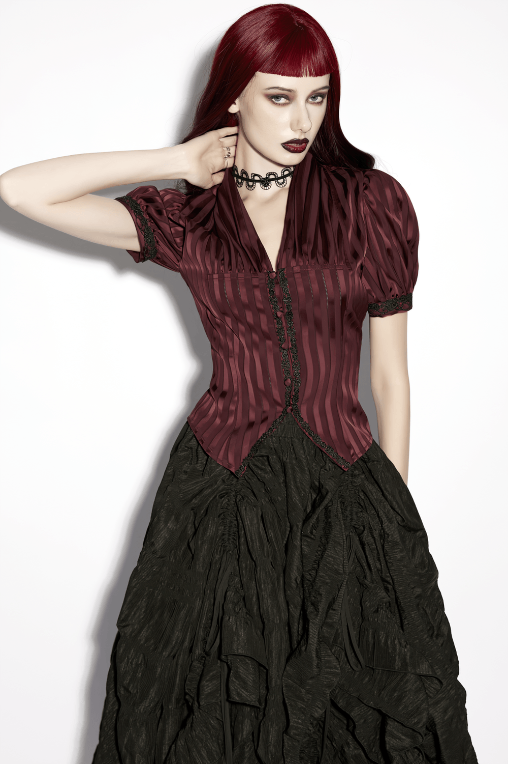 Burgundy Gothic Striped Lace-Up Puff Sleeve Shirt worn with a dramatic black skirt, showcasing its elegant design and style.