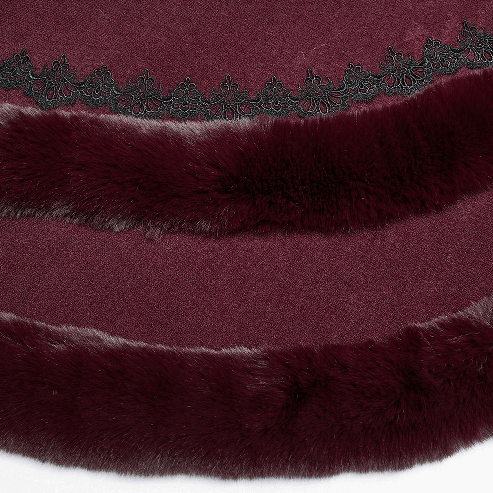 Close-up of burgundy cloak featuring luxurious fur trim and intricate lace hem detail.