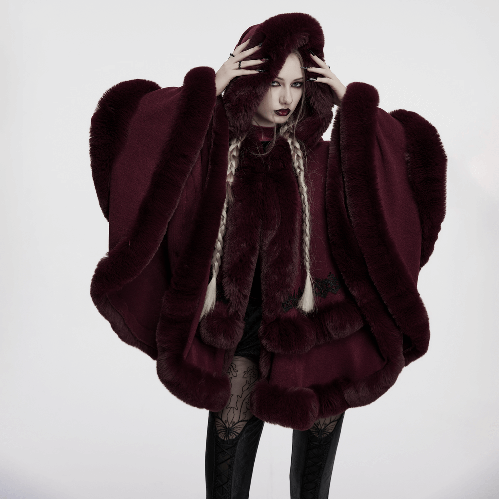 Elegant burgundy hooded cloak with luxurious fur trim and lace hem, perfect for a stylish and cozy look.