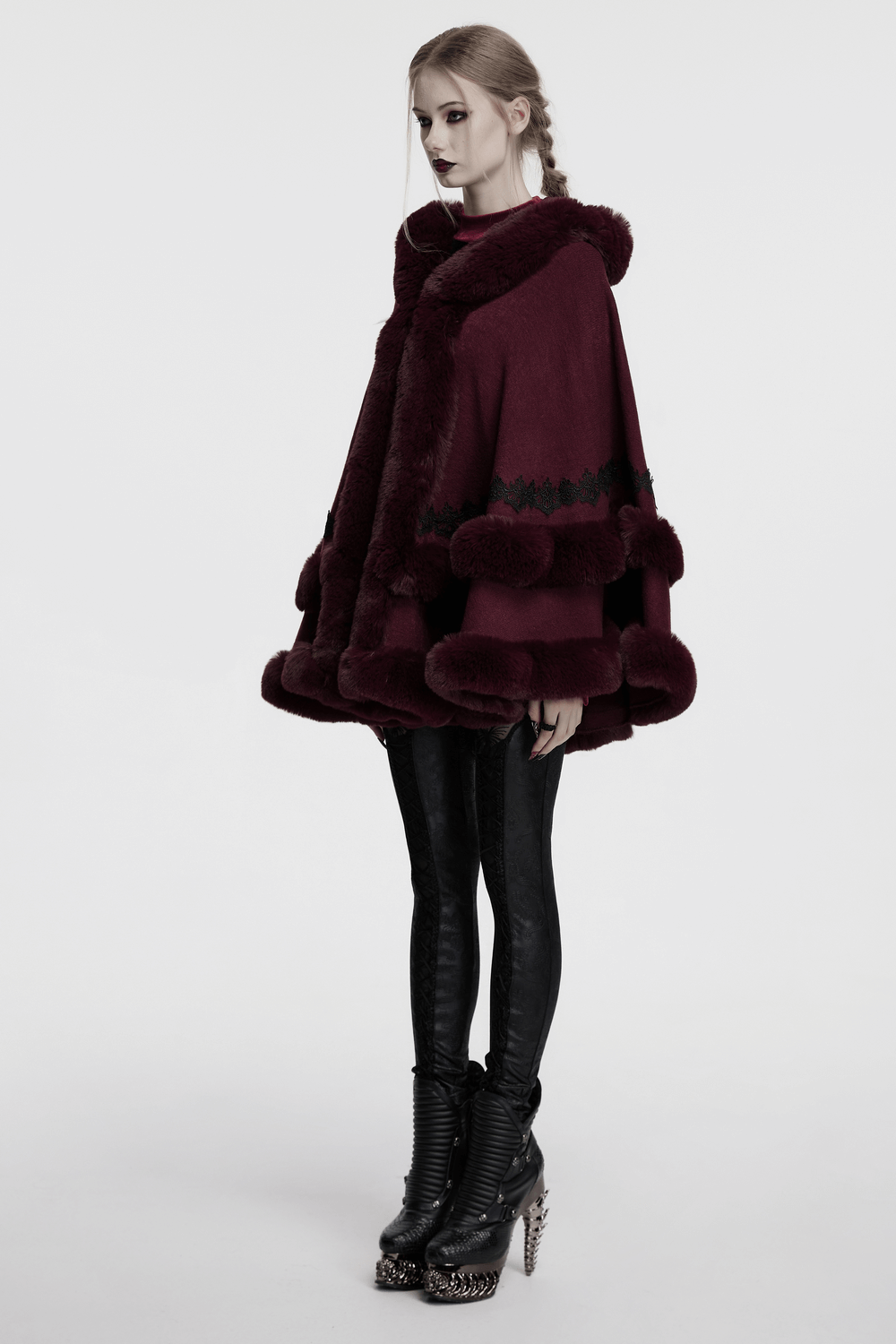 Burgundy hooded cloak with fur trim and lace hem, perfect for stylish winter looks and cozy warmth.
