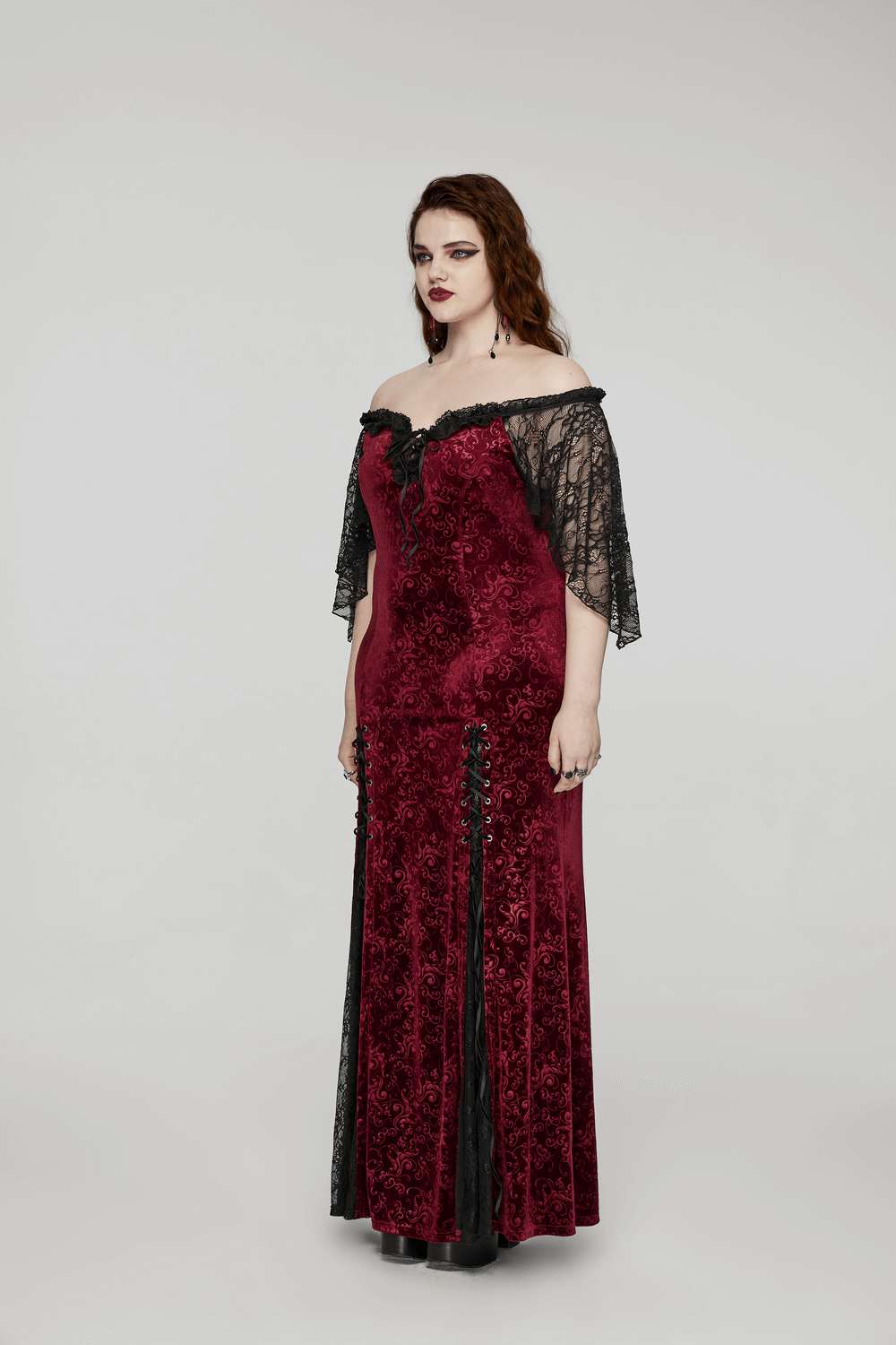 Burgundy off-shoulder velvet gown with lace sleeves and ruffle edge, showcasing gothic elegance and timeless charm.