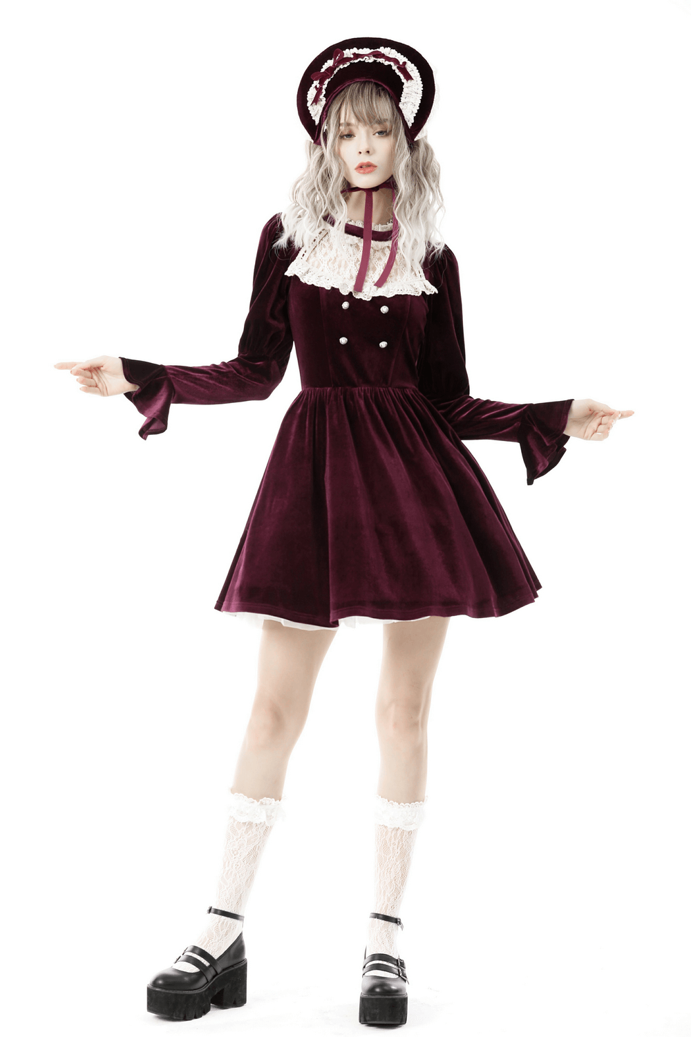 Burgundy velvet dress with delicate lace accents and matching hat, perfect for a vintage-inspired look.