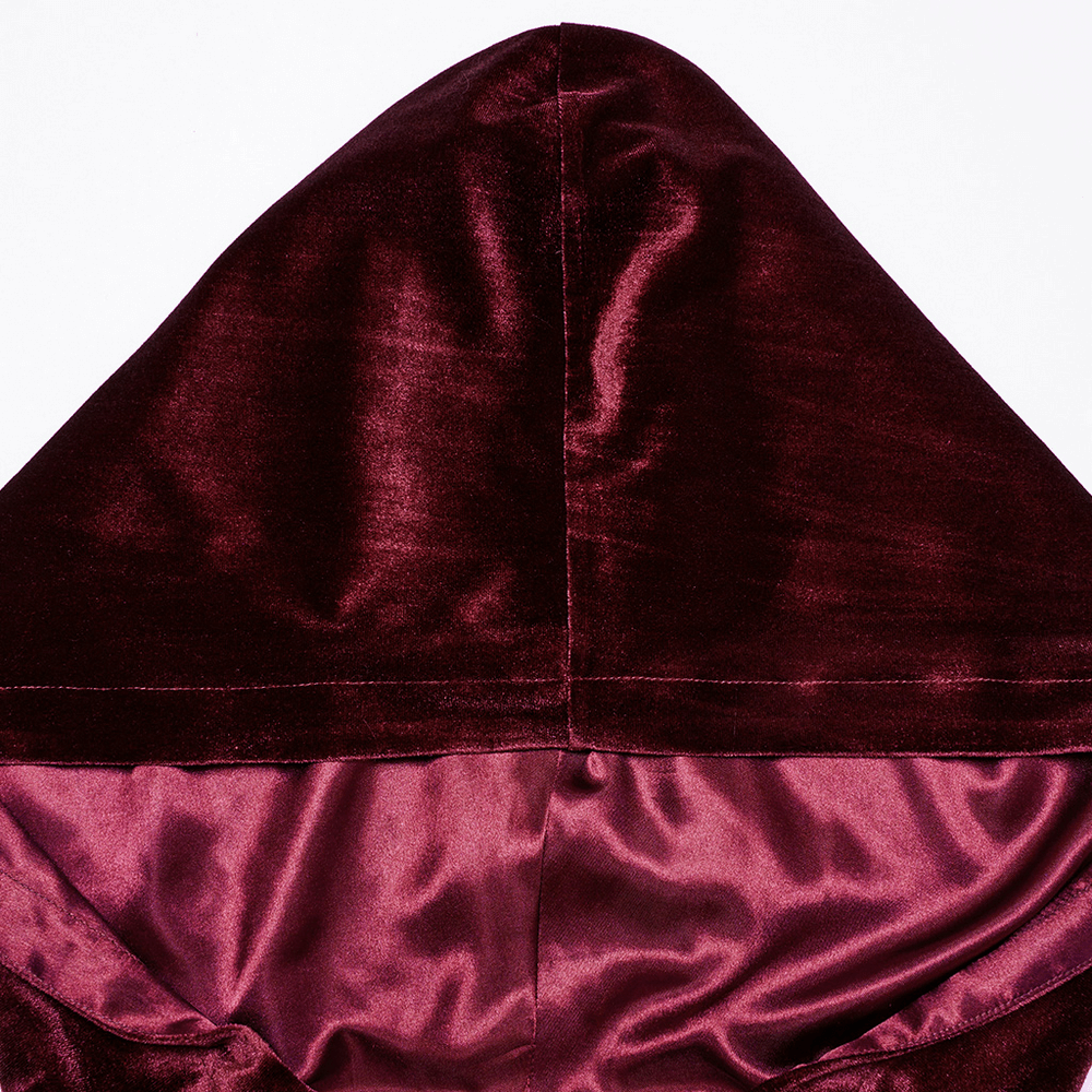 Close-up of the burgundy velvet hood of the cape, showcasing its luxurious fabric and elegant design.