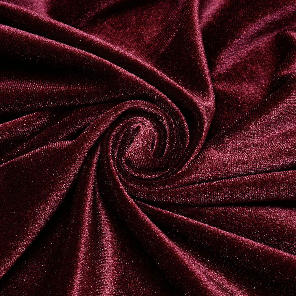 Close-up of luxurious burgundy velvet fabric, showcasing its rich texture and sheen.