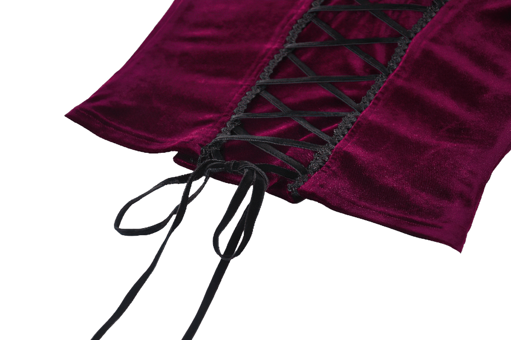 Close-up of burgundy velvet lace corset top with intricate black lacing and ribbon ties, perfect for stylish outfits.