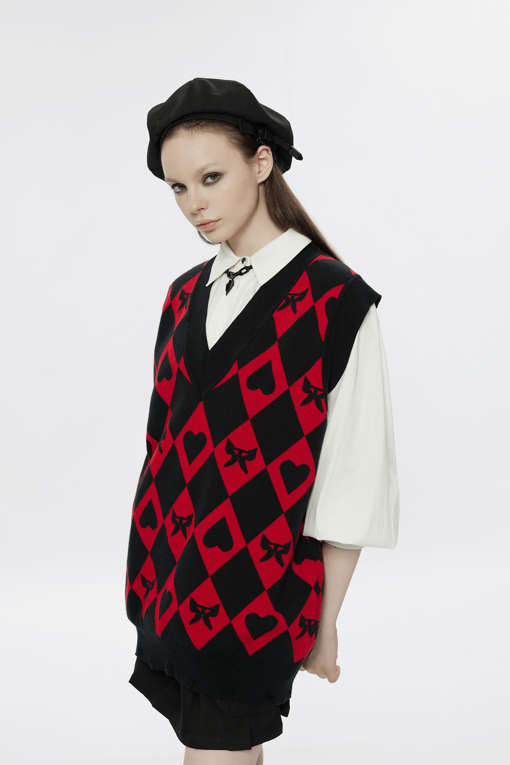 Punk Rave women's diamond weave vest in black and red argyle with heart and butterfly pattern, styled with beret.