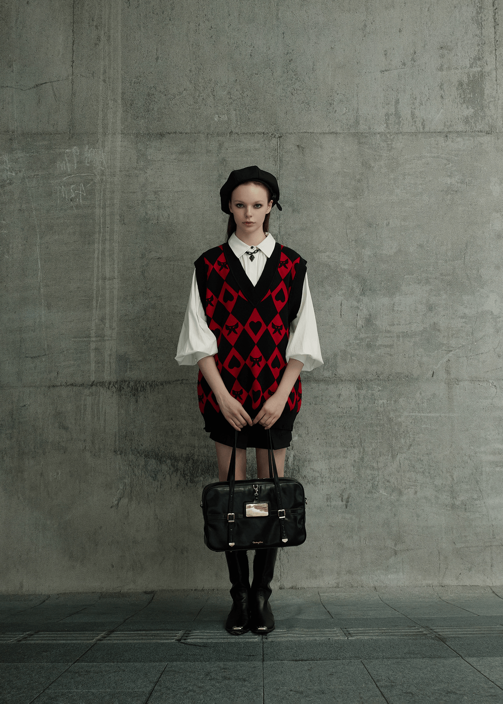 Punk Rave Women's diamond weave vest with red and black argyle pattern, featuring butterflies and hearts, styled with a chic bag.