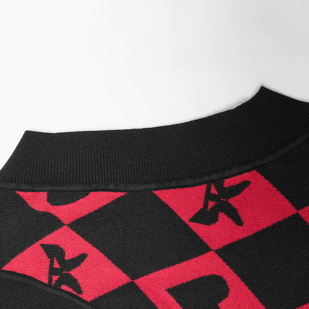 Close-up of the black and red argyle collar on the Punk Rave diamond weave vest with butterfly and heart patterns.