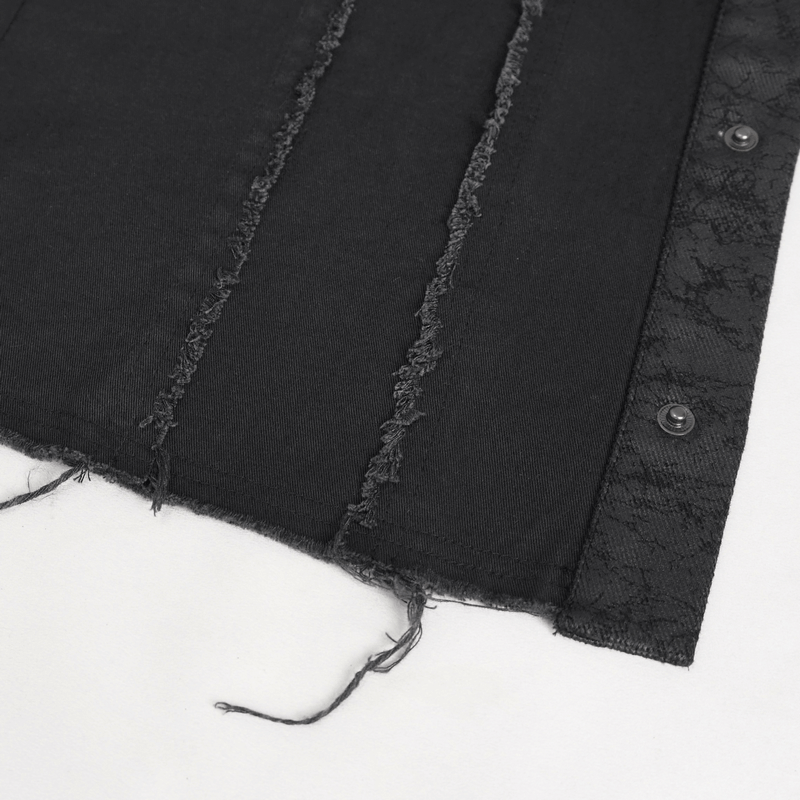 Close-up of a black punk button front sleeveless shirt with frayed edges and asymmetrical embellishments.