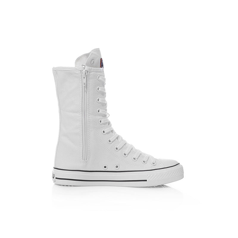 White canvas mid-calf sneakers with lace-up and zipper, perfect for rock and grunge style looks.