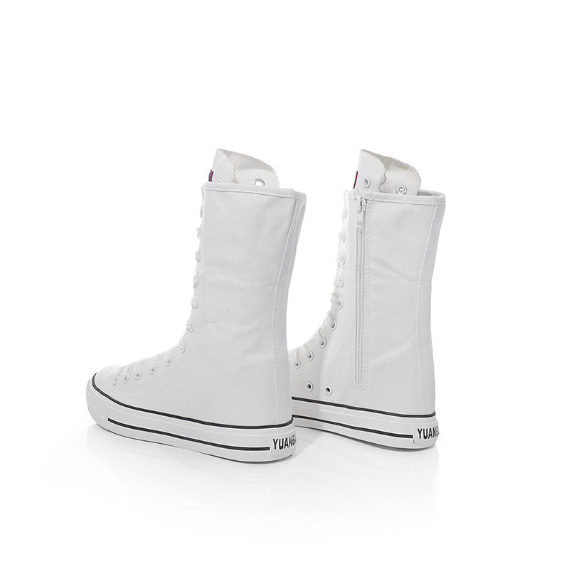 White canvas mid calf sneakers with lace-up design, perfect for female rock style outfits.